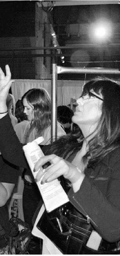 Bleu Briggs does makeup backstage during New York Fashion Week for Kevyn Aucoin Beauty.